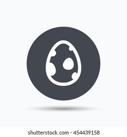 Dinosaur egg icon. Birth symbol. egg concept. Flat web button with icon on white background. Gray round press button with shadow. Vector
