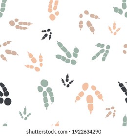 Dinosaur footprint tracks. Minimal color seamless pattern. Background with paw, claw predator. Dinosaur footprint seamless pattern perfect for textile, wrap and wallpaper and design