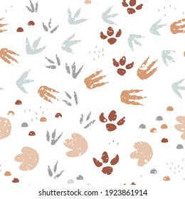 Dinosaur footprints seamless pattern. Background with dino feet steps traces. Jurassic animals path. Vector illustration for kids textile or floor mats.