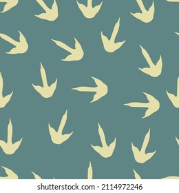 Dinosaur footprints seamless pattern. Green vector background with dinosaur paw prints. Simple texture of prehistoric dino predator. Design for children's textiles, packaging, fabric, wallpaper.
