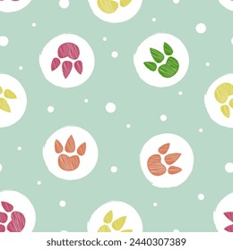 Dinosaur footprints seamless pattern. Polka dot childish vector illustration. Colorful dinosaur paws