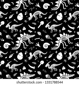 Dinosaur skeleton and fossils. Vector seamless pattern. Original design with dinosaur bones, stones, traces, plants and eggs. Print for T-shirts, textiles, web.Black background.