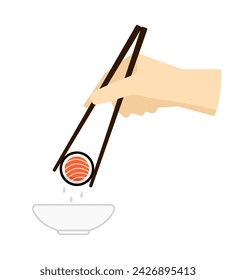 Sushi in Sojasauce eintauchen