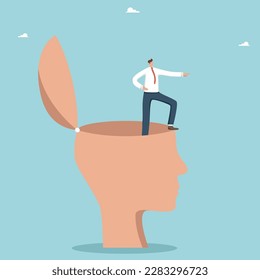 La dirección del desarrollo personal, encontrar cualidades de liderazgo en uno mismo para alcanzar picos y crecimiento de carrera, encontrar una estrategia exitosa para los negocios, un hombre con una gran cabeza humana muestra la dirección.