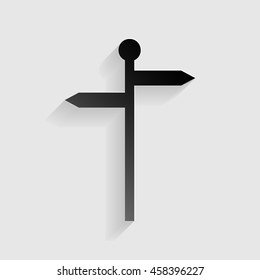 Direction road sign. Black paper with shadow on gray background.