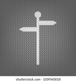 Direction road sign. Vector. White knitted icon on gray knitted background. Isolated.