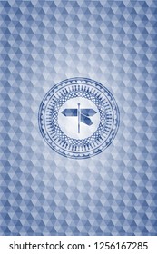 directions sign icon inside blue emblem with geometric pattern background.