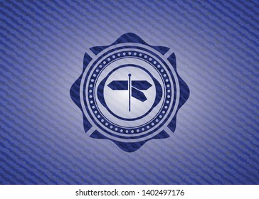directions sign icon inside emblem with jean background