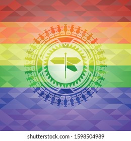 directions sign icon inside emblem on mosaic background with the colors of the LGBT flag
