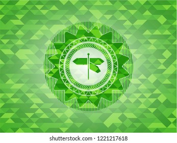 directions sign icon inside green emblem with triangle mosaic background