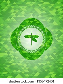 directions sign icon inside green emblem with triangle mosaic background