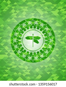 directions sign icon inside green emblem with triangle mosaic background
