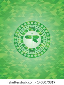 directions sign icon inside green emblem with triangle mosaic background