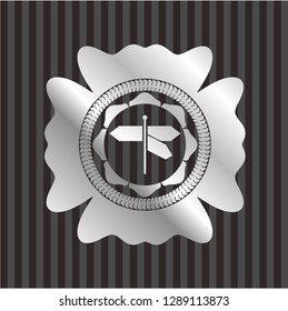 directions sign icon inside silver emblem