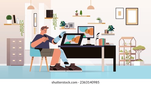 disabled man graphic designer with replaced robotic leg and arm guy working on laptop people with disabilities concept