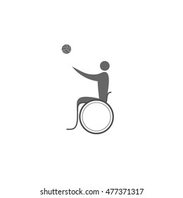 A disabled person in a wheelchair playing handball
