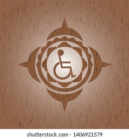 disabled (wheelchair) icon inside badge with wood background