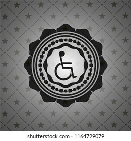 disabled (wheelchair) icon inside black emblem