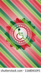 disabled (wheelchair) icon inside christmas colors style emblem.
