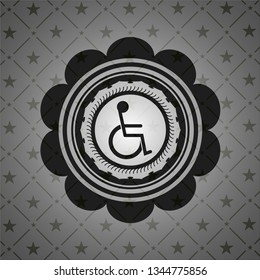 disabled (wheelchair) icon inside dark badge or emblem