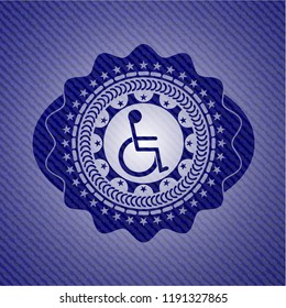 disabled (wheelchair) icon inside emblem with jean background