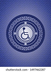 disabled (wheelchair) icon inside emblem with jean background