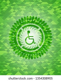 disabled (wheelchair) icon inside green emblem with triangle mosaic background
