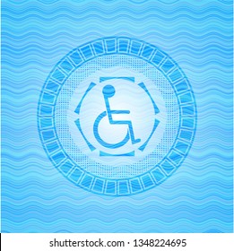disabled (wheelchair) icon inside light blue water emblem.