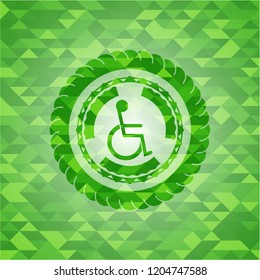 disabled (wheelchair) icon inside realistic green mosaic emblem