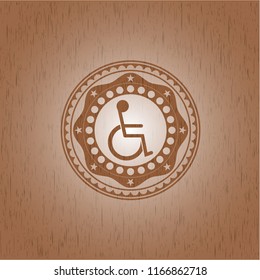 disabled (wheelchair) icon inside retro wooden emblem