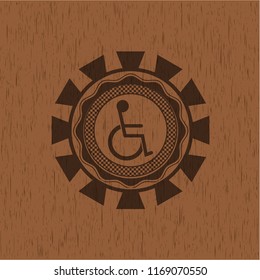 disabled (wheelchair) icon inside retro wooden emblem