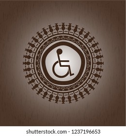 disabled (wheelchair) icon inside retro wooden emblem