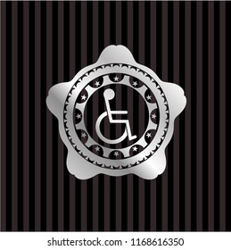 disabled (wheelchair) icon inside silver emblem