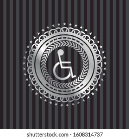 disabled wheelchair icon inside silver badge