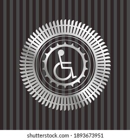 disabled (wheelchair) icon inside silver emblem or badge. 