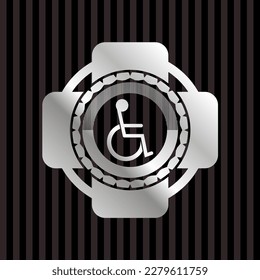 disabled (wheelchair) icon inside silver shiny emblem. 