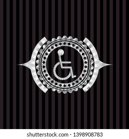 disabled (wheelchair) icon inside silvery emblem