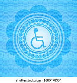 disabled (wheelchair) icon inside sky blue water badge background.