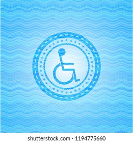 disabled (wheelchair) icon inside water wave representation style badge.