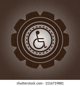 disabled (wheelchair) icon inside wood emblem