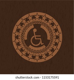 disabled (wheelchair) icon inside wooden emblem. Retro