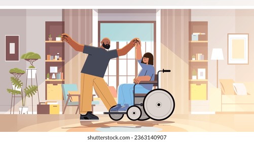 disabled woman sitting in wheelchair and dancing with man people with disabilities concept modern living room interior