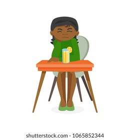 Disappointed african-american woman sitting at the table with orange alcohol cocktail. Woman in depression resting in the bar with alcohol. Vector cartoon illustration isolated on white background.