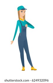 Disappointed caucasian mechanic with thumb down. Full length of female mechanic showing thumb down. Young mechanic with her thumb down. Vector flat design illustration isolated on white background.
