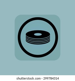 Disc pile in circle, in square, on pale blue background