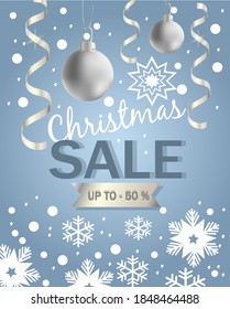 discount banner for christmas with silver christmas balls, serpentine and snowflakes on a blue background and the inscription christmas sale