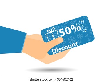 Discount coupons in hand. 50-percent discount. Special offer. Snowflakes and gift boxes.
