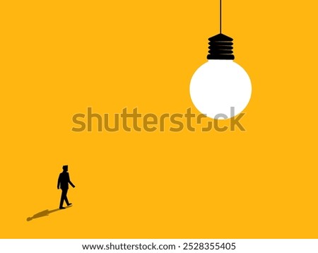 Discover knowledge. Businessman walks to the light bulb of wisdom