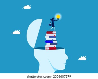 Discover new knowledge or wisdom. Businesswoman holding light bulb on stack of books in human head
