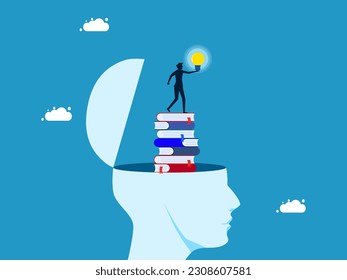 Discover wisdom. Businessman holding light bulb on stack of books in human head